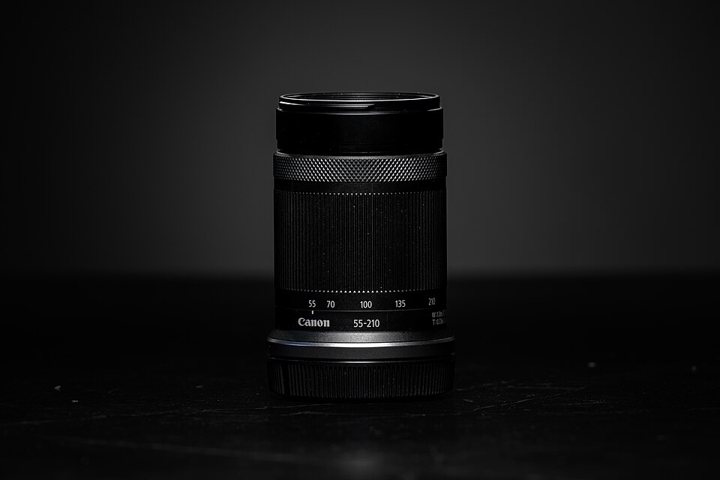 Canon RF-S 55–210mm telephoto zoom lens.